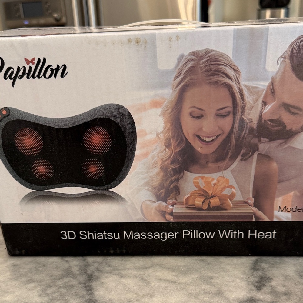 Papillon 3D pillow massager with heat.